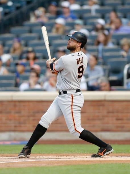 Brandon Belt of the San Francisco Giants follows through on his first inning home run against the New York Mets at Citi Field on August 24, 2021 in...
