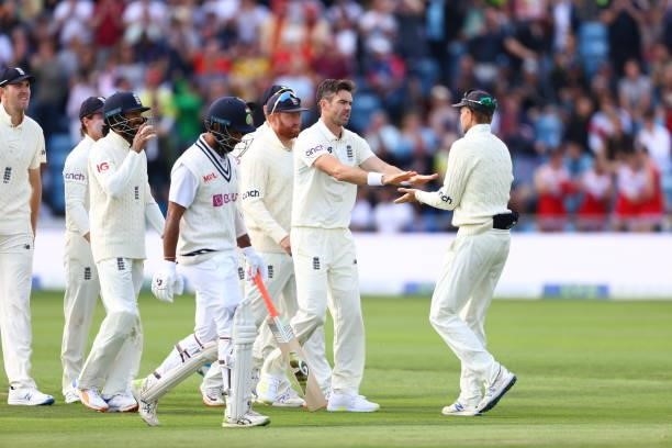 James Anderson of England celebrates with Joe Root after taking the wicket of Cheteshwar Pujara at Emerald Headingley Stadium on August 25, 2021 in...