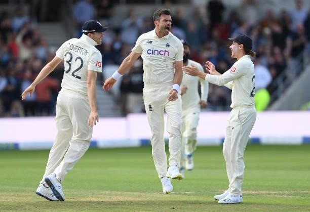 James Anderson celebrates with Craig Overton and Rory Burns of England after dismissing Virat Kohli of India during the 3rd LV= Test Match between...