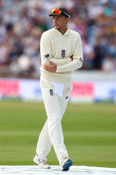 England captain Joe Root leaves the field after taking a blow to a finger whilst fielding during day one of the Third Test Match between England and...