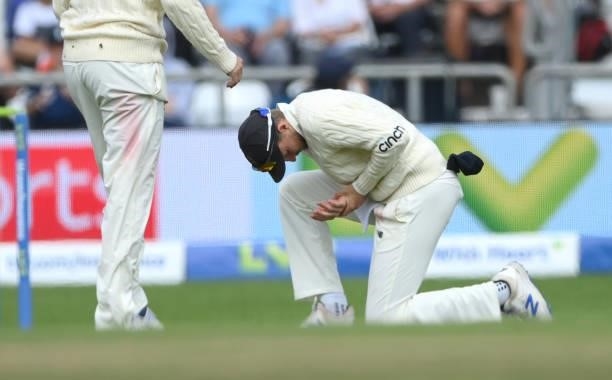 England captain Joe Root reacts after injuring his thumb in the slips during day one of the Third Test Match between England and India at Emerald...
