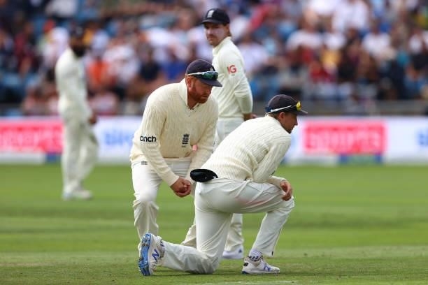 Jonny Bairstow looks on as England captain Joe Root injures a finger whilst fielding during day one of the Third Test Match between England and India...