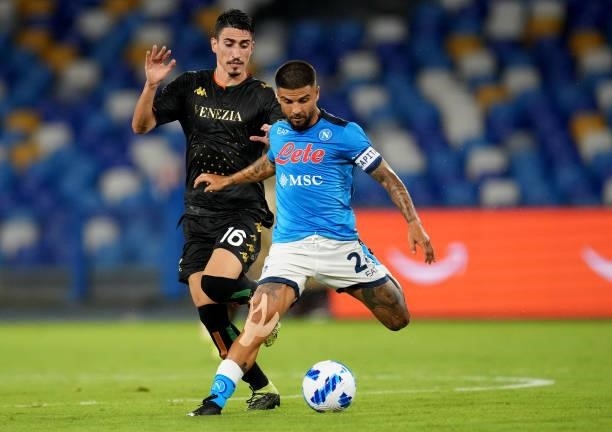 Lorenzo Insigne of SSC Napoli competes for the ball with Luca Fiordilino of Venezia FC ,during the Serie A match between SSC Napoli v Venezia FC at...