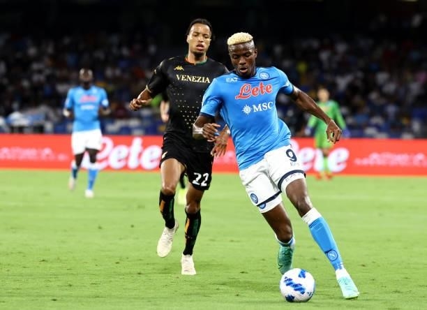 Victor Osimhen of SSC Napoli competes for the ball with Tyronne Ebuehi of Venezia FC ,during the Serie A match between SSC Napoli v Venezia FC at...