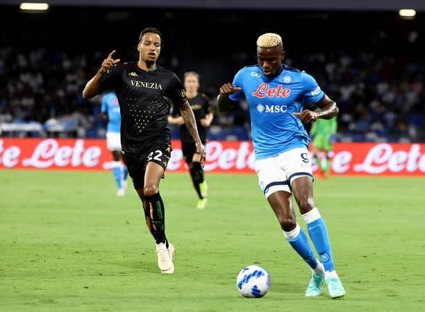 Victor Osimhen of SSC Napoli competes for the ball with Tyronne Ebuehi of Venezia FC ,during the Serie A match between SSC Napoli v Venezia FC at...
