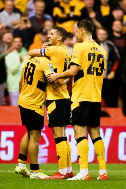 Morgan Gibbs-White of Wolverhampton Wanderers celebrates with teammates after scoring his team's fourth goal during the Carabao Cup Second Round...