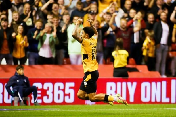 Morgan Gibbs-White of Wolverhampton Wanderers celebrates after scoring his team's fourth goal during the Carabao Cup Second Round match between...