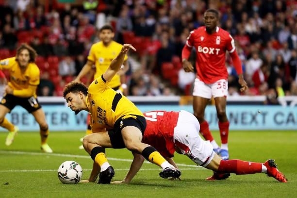 Rayan Ait-Nouri of Wolverhampton Wanderers is challenged by Finley Back of Nottingham Forest during the Carabao Cup Second Round match between...
