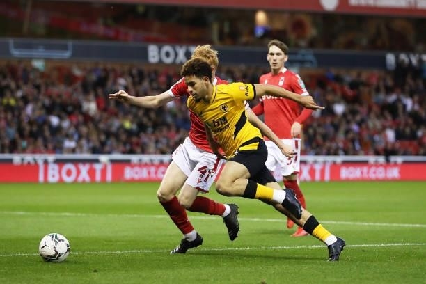 Rayan Ait-Nouri of Wolverhampton Wanderers is challenged by Oliver Hammond of Nottingham Forest during the Carabao Cup Second Round match between...