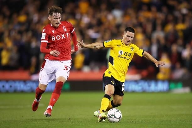Daniel Podence of Wolverhampton Wanderers runs with the ball under pressure from James Garner of Nottingham Forest during the Carabao Cup Second...