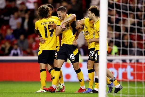Romain Saiss of Wolverhampton Wanderers celebrates with teammates after scoring his team's first goal during the Carabao Cup Second Round match...