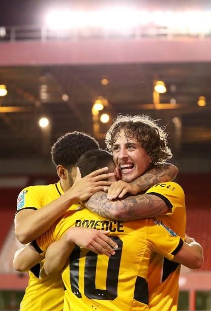 Daniel Podence of Wolverhampton Wanderers celebrates with Fabio Silva and Morgan Gibbs-White after scoring his team's second goal during the Carabao...