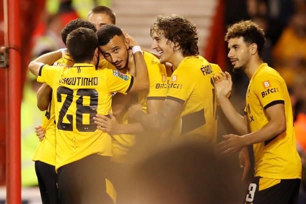 Romain Saiss of Wolverhampton Wanderers celebrates with teammates after scoring his team's first goal during the Carabao Cup Second Round match...
