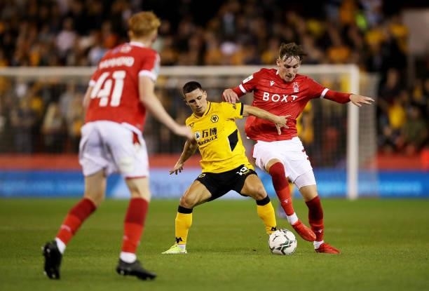 Daniel Podence of Wolverhampton Wanderers is challenged bis challenged by James Garner of Nottingham Forest during the Carabao Cup Second Round match...