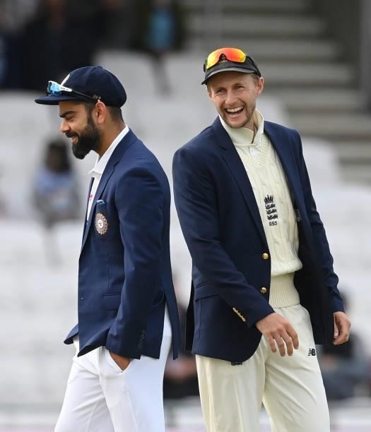 Joe Root of England laughs as Virat Kohli of India calls correctly and wins the toss before the 3rd LV= Test Match between England and India at...