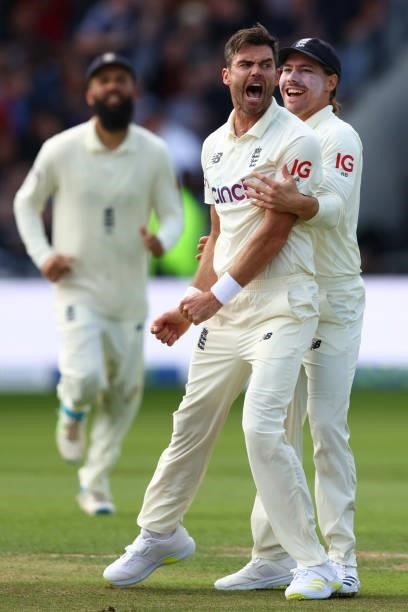 James Anderson of England celebrates with Rory Burns after taking the wicket of Virat Kohli of India at Emerald Headingley Stadium on August 25, 2021...