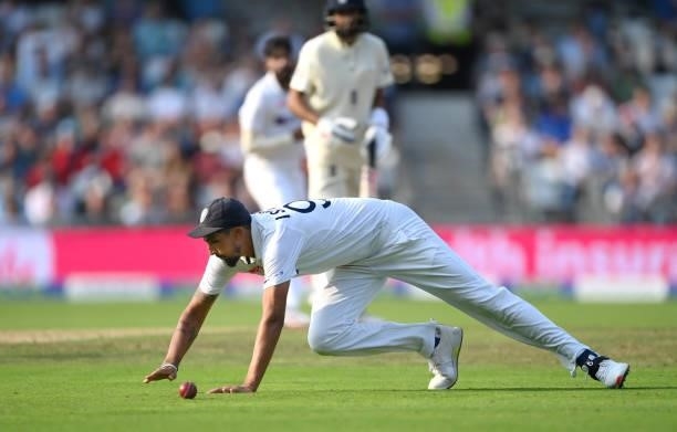 India fielder Ishant Sharma dives in vain to stop a 4 hit from Rory Burns going to the boundary during day one of the Third Test Match between...
