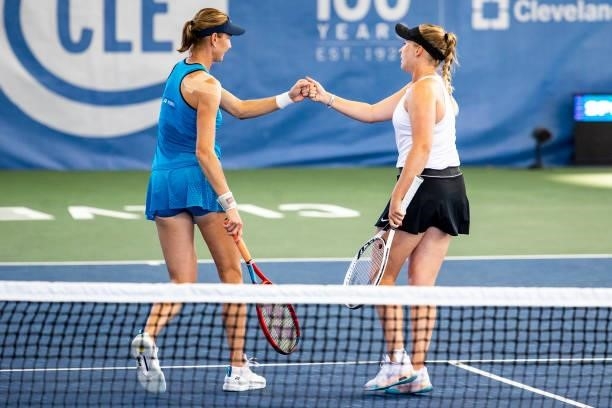Renata Voráová of Czechia gives Julia Lohoff of Germany a fist bump during their doubles match against Bethanie Mattek-Sands of USA and Shelby Rogers...