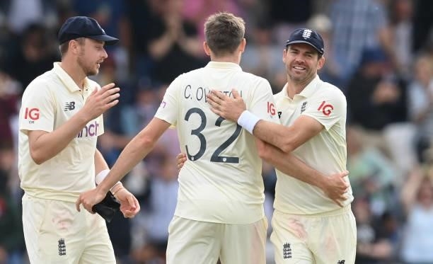 Ollie Robinson, Craig Overton and James Anderson of England celebrate after the dismissal of Mohammed Siraj during the 3rd LV= Test Match between...