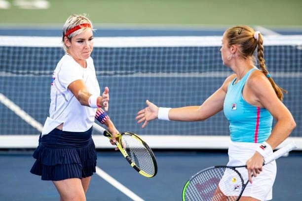 Bethanie Mattek-Sands of USA and Shelby Rogers of USA high five during the first set of their match against Julia Lohoff of Germany and Renata...