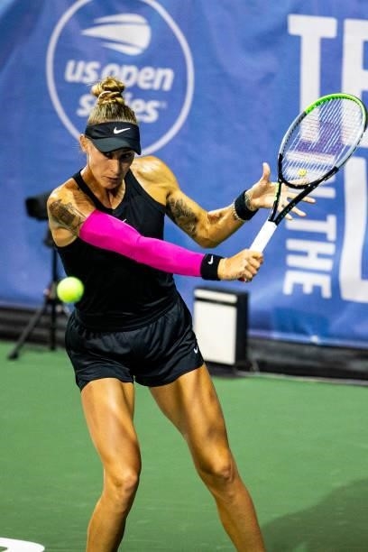 Polona Hercog of Slovenia backhands the ball to Irina-Camelia Begu of Romania during the first set of their match on day 3 of the Cleveland...