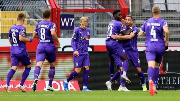 Marc Heider of Osnabrueck celebrates the first goal with his team mates during the 3. Liga match between VfL Osnabrück and Borussia Dortmund II at...