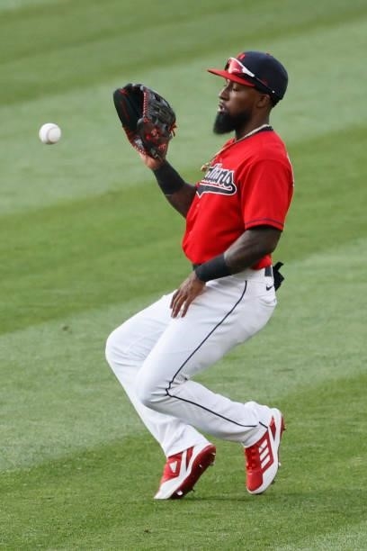Daniel Johnson of the Cleveland Indians fields a ball against the Texas Rangers during the first inning at Progressive Field on August 24, 2021 in...