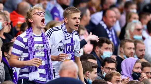 Fans of Osnabrueck react during the 3. Liga match between VfL Osnabrück and Borussia Dortmund II at Stadion an der Bremer Brücke on August 25, 2021...