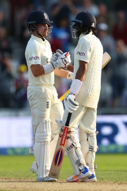 Rory Burns of England is congratulated by opening partner Haseeb Hameed after reaching his fifty during day one of the Third Test Match between...