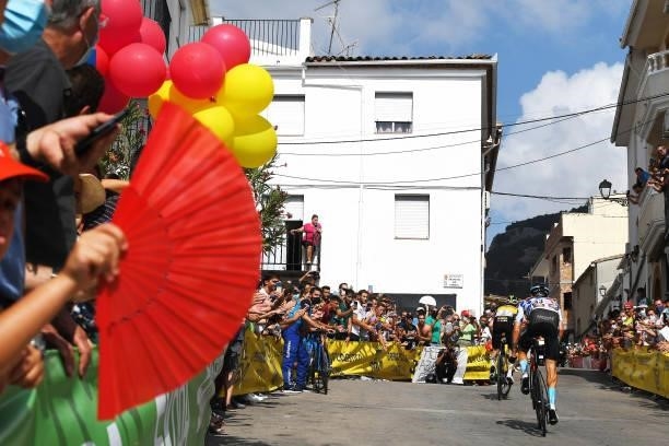 Damiano Caruso of Italy and Team Bahrain Victorious Polka Dot Mountain Jersey passing through Valdepeñas de Jaén Village while fans cheer during the...