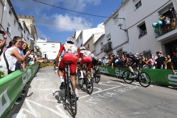José Herrada Lopez of Spain and Team Cofidis and The Peloton passing through Valdepeñas de Jaén Village while fans cheer during the 76th Tour of...