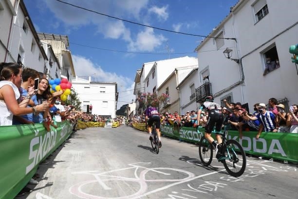 Ángel Madrazo Ruiz of Spain and Team Burgos - BH and Nicholas Schultz of Australia and Team BikeExchange passing through Valdepeñas de Jaén Village...