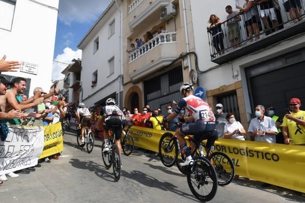 Alex Kirsch of Luxembourg and Team Trek - Segafredo wheelies passing through Valdepeñas de Jaén Village while fans cheer during the 76th Tour of...