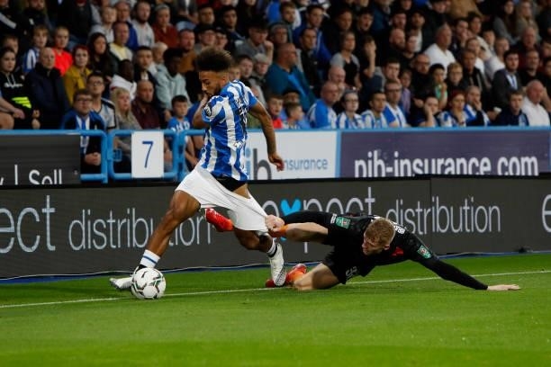 Sorba Thomas of Huddersfield Town has his shorts pulled by Jarrad Branthwaite of Everton during the game between Huddersfield Town and Everton in the...