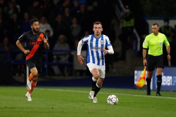 Harry Toffolo of Huddersfield Town races away from Andros Townsend of Everton during the game between Huddersfield Town and Everton in the second...