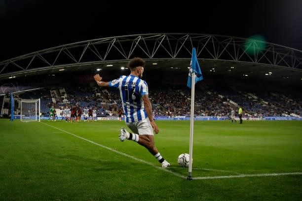 Sorba Thomas of Huddersfield Town takes a corner in the final minutes of the game between Huddersfield Town and Everton in the second round of the...