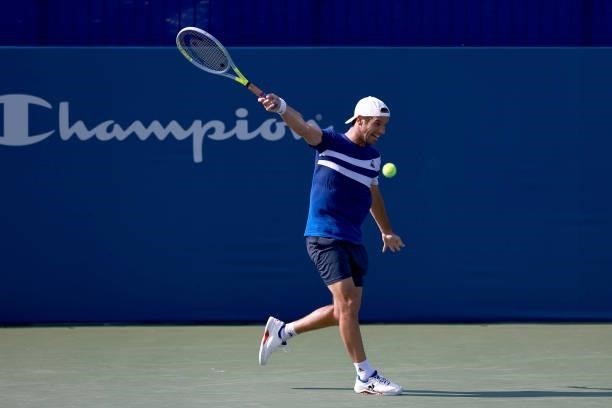 Richard Gasquet of France returns a shot to Daniel Evans of Great Britain on Day 5 of the Winston-Salem Open at Wake Forest Tennis Complex on August...