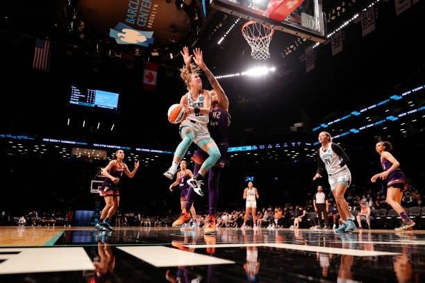 Sabrina Ionescu of the New York Liberty goes to the basket as Brittney Griner of the Phoenix Mercury defends during the first half at Barclays Center...