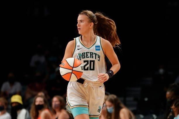 Sabrina Ionescu of the New York Liberty dribbles during the first half against the Phoenix Mercury at Barclays Center on August 25, 2021 in the...