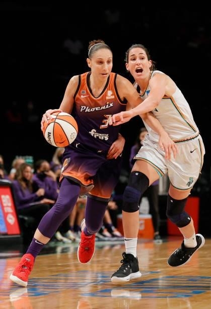 Diana Taurasi of the Phoenix Mercury dribbles against Rebecca Allen of the New York Liberty during the second half at Barclays Center on August 25,...