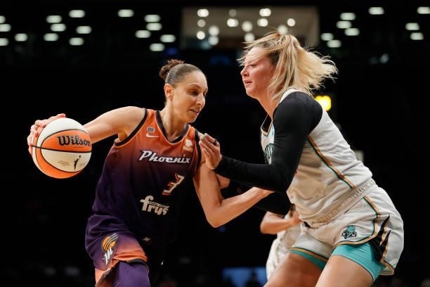 Diana Taurasi of the Phoenix Mercury dribbles against Kylee Shook of the New York Liberty during the second half at Barclays Center on August 25,...