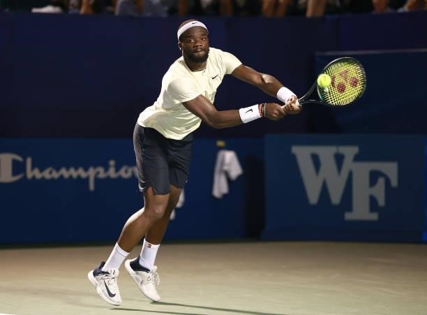 Frances Tiafoe returns a shot to Thiago Monteiro of Brazil on Day 5 of the Winston-Salem Open at Wake Forest Tennis Complex on August 25, 2021 in...