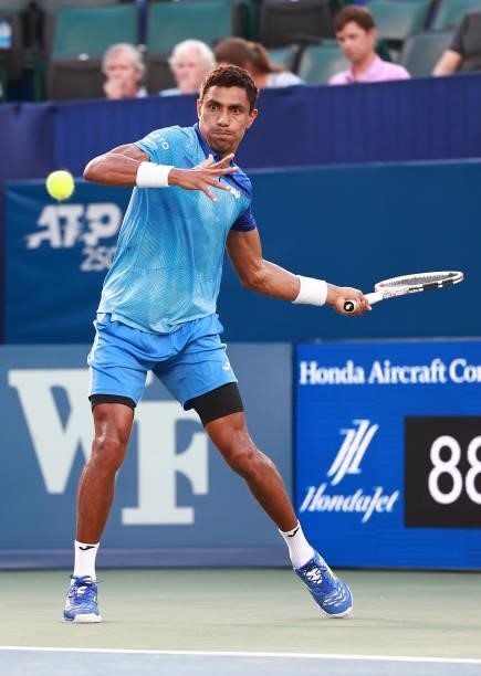 Thiago Monteiro of Brazil returns a shot to Frances Tiafoe on Day 5 of the Winston-Salem Open at Wake Forest Tennis Complex on August 25, 2021 in...