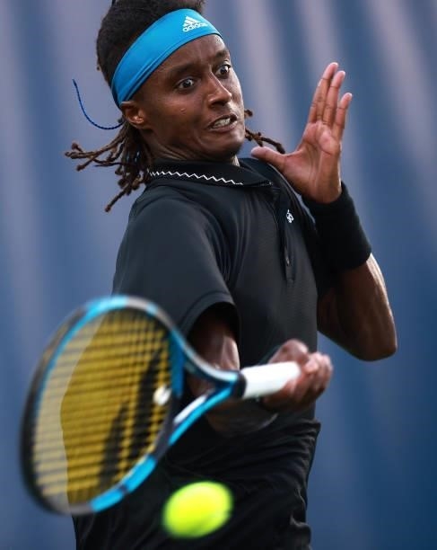 Mikael Ymer of Sweden returns a shot to Max Purcell of Australia on Day 5 of the Winston-Salem Open at Wake Forest Tennis Complex on August 25, 2021...