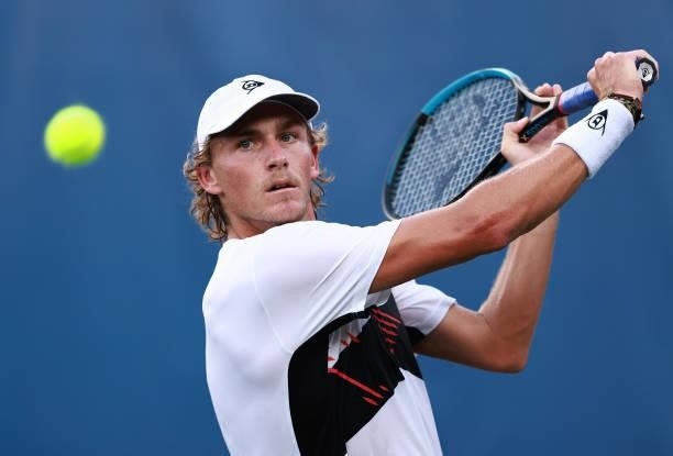 Max Purcell of Australia retuns a shot to Mikael Ymer of Sweden on Day 5 of the Winston-Salem Open at Wake Forest Tennis Complex on August 25, 2021...