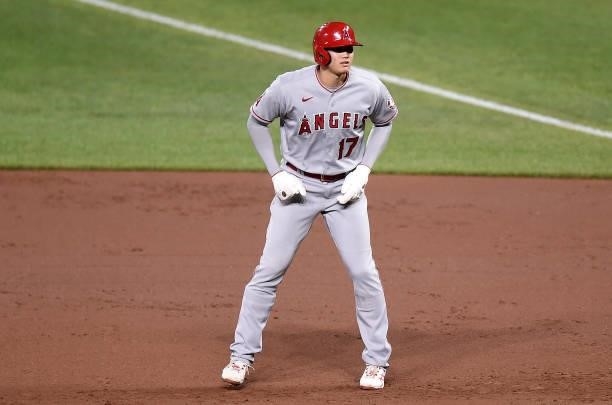 Shohei Ohtani of the Los Angeles Angels takes a lead off of first base in the eighth inning against the Baltimore Orioles at Oriole Park at Camden...