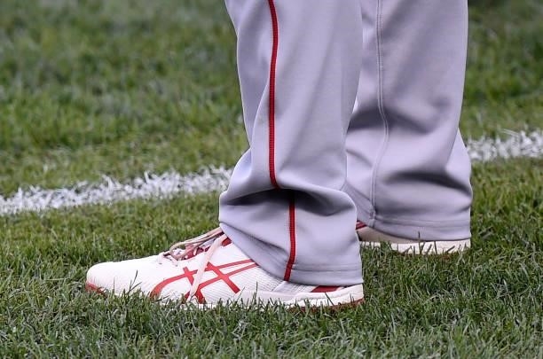 Shohei Ohtani of the Los Angeles Angels wears Asics shoes before the game against the Baltimore Orioles at Oriole Park at Camden Yards on August 24,...