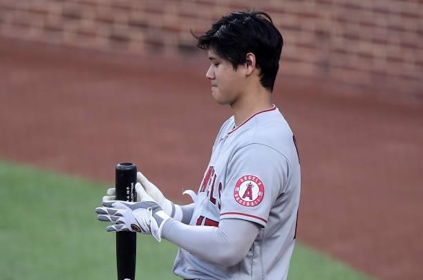 Shohei Ohtani of the Los Angeles Angels gets ready to bat before the start of the first inning against the Baltimore Orioles at Oriole Park at Camden...