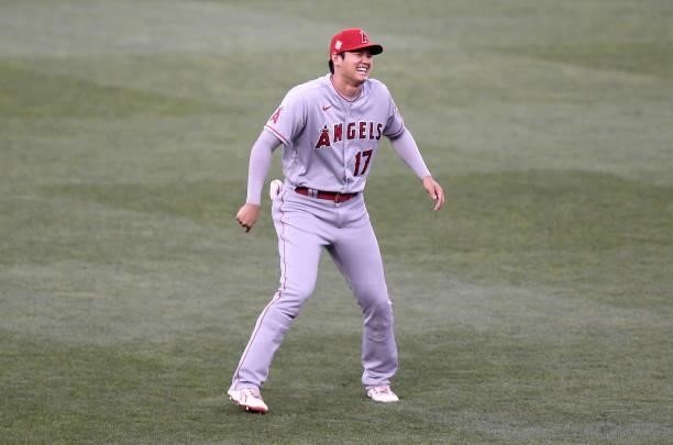 Shohei Ohtani of the Los Angeles Angels warms up before the game against the Baltimore Orioles at Oriole Park at Camden Yards on August 24, 2021 in...