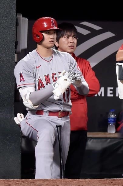 Shohei Ohtani of the Los Angeles Angels watches the game against the Baltimore Orioles at Oriole Park at Camden Yards on August 24, 2021 in...